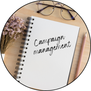 Image of notebook with campaign management text